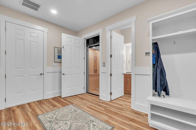 209 S 11th St, Morehead City, NC 28557 - unfurnished bedroom with light wood finished floors, connected bathroom, and recessed lighting