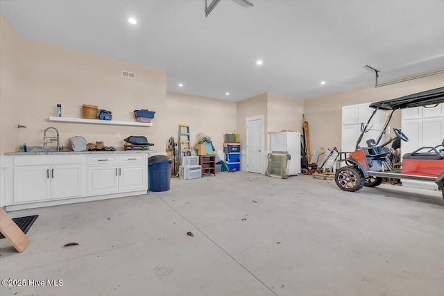 209 S 11th St, Morehead City, NC 28557 - garage with freestanding refrigerator, recessed lighting, and a sink