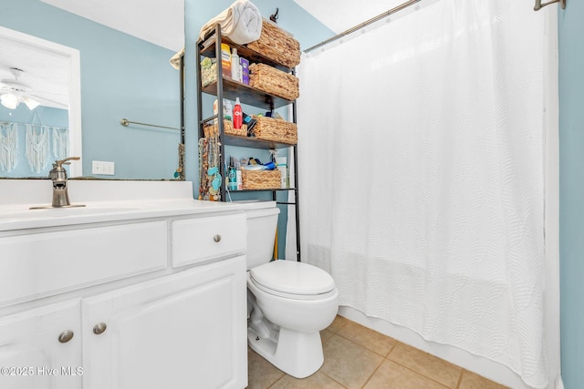 208 Carolina Beach Ave S Unit 202, Carolina Beach, NC 28428 - bathroom featuring tile patterned flooring, vanity, toilet, a shower with curtain, and a ceiling fan