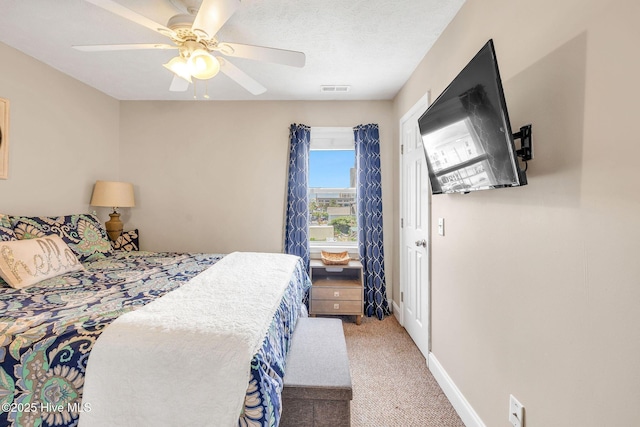 208 Carolina Beach Ave S Unit 202, Carolina Beach, NC 28428 - carpeted bedroom with a ceiling fan and baseboards