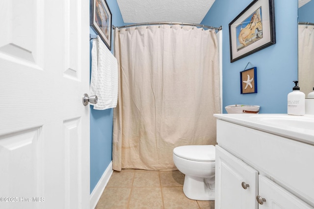 208 Carolina Beach Ave S Unit 202, Carolina Beach, NC 28428 - bathroom with vanity, toilet, tile patterned floors, a textured ceiling, and a shower with curtain