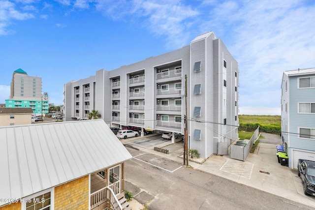 208 Carolina Beach Ave S Unit 202, Carolina Beach, NC 28428 - view of apartment building / complex featuring uncovered parking