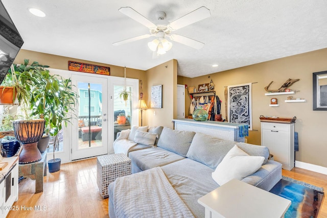 208 Carolina Beach Ave S Unit 202, Carolina Beach, NC 28428 - living area with light wood-type flooring, ceiling fan, french doors, recessed lighting, and baseboards