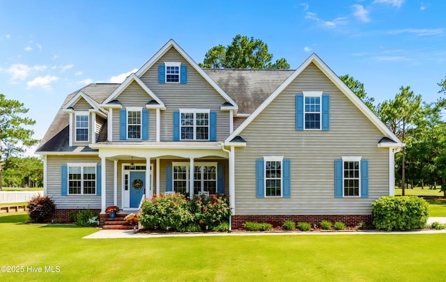 110 Gemini Dr, Cape Carteret, NC 28584 - view of front facade with a porch and a front yard