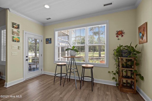 110 Gemini Dr, Cape Carteret, NC 28584 - dining room with wood finished floors and ornamental molding