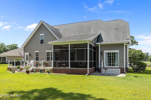 110 Gemini Dr, Cape Carteret, NC 28584 - rear view of property with a sunroom, a yard, and a shingled roof