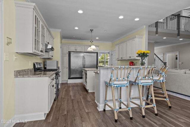 110 Gemini Dr, Cape Carteret, NC 28584 - kitchen featuring stainless steel appliances, a peninsula, glass insert cabinets, dark wood-style flooring, and light stone countertops