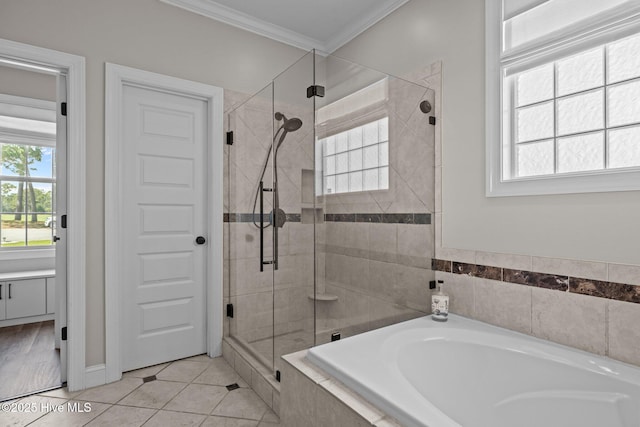 110 Gemini Dr, Cape Carteret, NC 28584 - full bath with ornamental molding, a bath, a stall shower, healthy amount of natural light, and tile patterned floors
