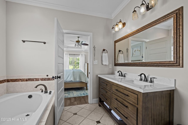 110 Gemini Dr, Cape Carteret, NC 28584 - ensuite bathroom with double vanity, a garden tub, tile patterned floors, ornamental molding, and a ceiling fan