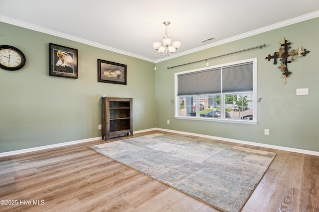 412 Palisades Way, New Bern, NC 28560 - unfurnished living room with a chandelier, wood finished floors, crown molding, and baseboards