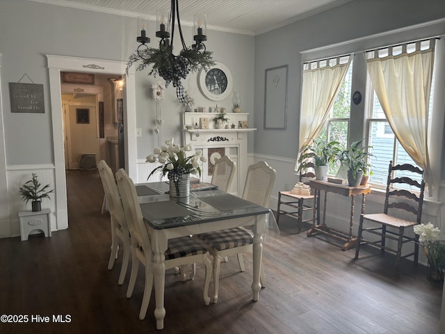 314 Ave B, New Bern, NC 28560 - dining room with ornamental molding, wood finished floors, and a wainscoted wall