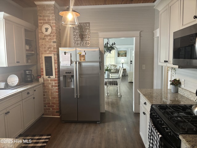 314 Ave B, New Bern, NC 28560 - kitchen with stainless steel appliances, dark wood finished floors, brick wall, white cabinets, and light stone counters