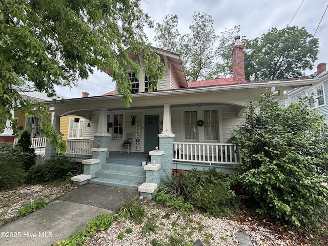 314 Ave B, New Bern, NC 28560 - view of front of property featuring covered porch and a chimney