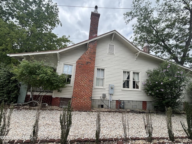 314 Ave B, New Bern, NC 28560 - view of property exterior with a chimney and crawl space