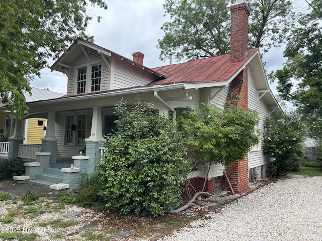 314 Ave B, New Bern, NC 28560 - view of front of house with a chimney and a porch