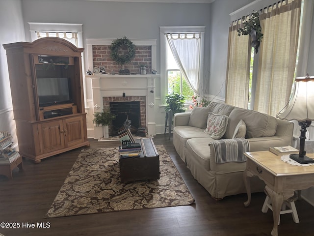 314 Ave B, New Bern, NC 28560 - living area featuring dark wood finished floors and a brick fireplace