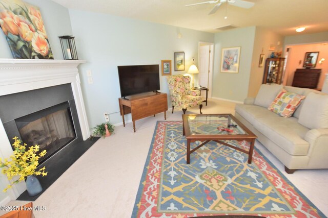 4717 Gardenia Cir, Rocky Mount, NC 27804 - living area with carpet flooring, baseboards, a ceiling fan, and a fireplace