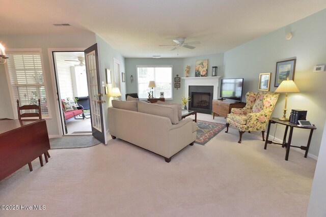 4717 Gardenia Cir, Rocky Mount, NC 27804 - living area with a ceiling fan, carpet flooring, a fireplace, and baseboards