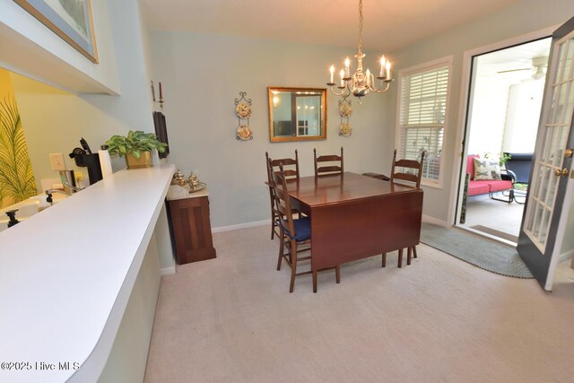 4717 Gardenia Cir, Rocky Mount, NC 27804 - dining room featuring light colored carpet, a chandelier, and baseboards