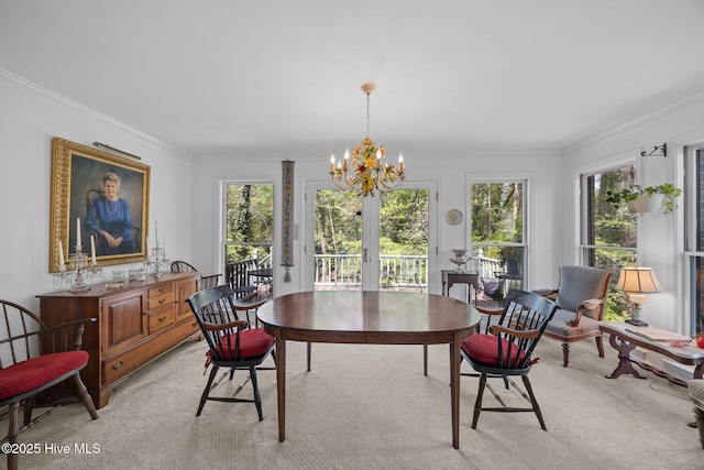 103 Camelia Dr, Washington, NC 27889 - dining room with french doors, ornamental molding, a chandelier, and light colored carpet