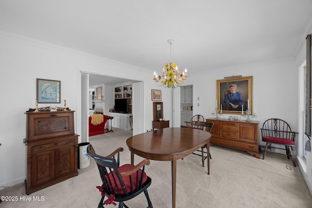 103 Camelia Dr, Washington, NC 27889 - dining area with light colored carpet, crown molding, and a chandelier
