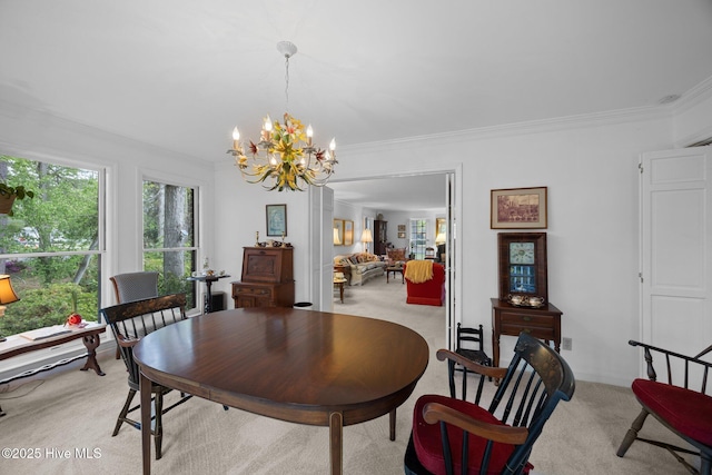 103 Camelia Dr, Washington, NC 27889 - dining area with light colored carpet, a chandelier, and crown molding