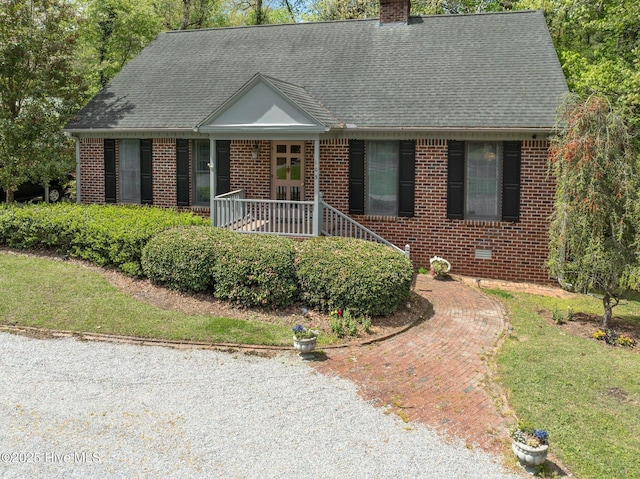 103 Camelia Dr, Washington, NC 27889 - view of front of house featuring brick siding, a chimney, a porch, and roof with shingles