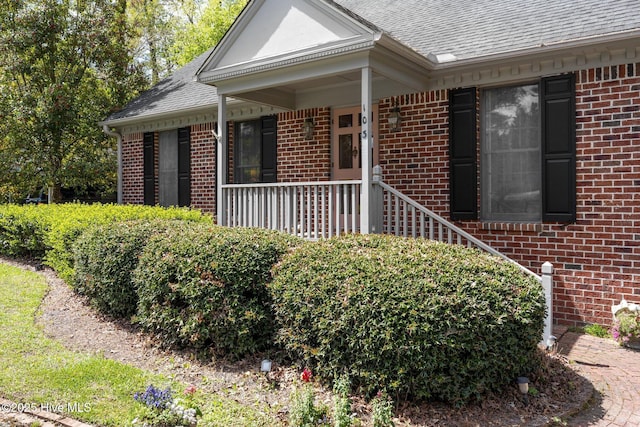 103 Camelia Dr, Washington, NC 27889 - view of front facade featuring brick siding, a shingled roof, and a porch