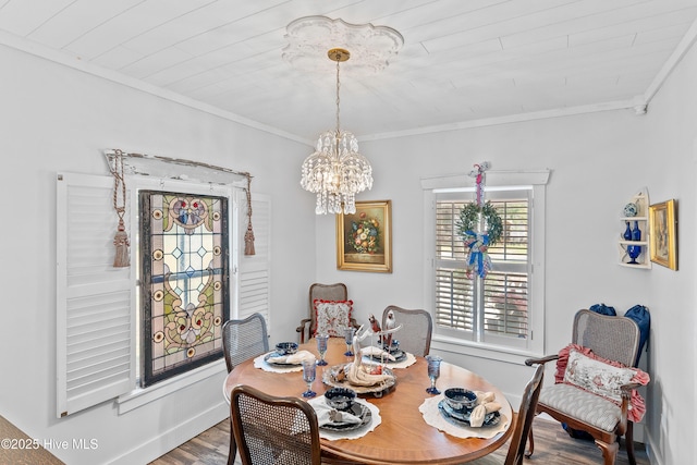 209 W St George St, Southport, NC 28461 - dining area with crown molding, a chandelier, and wood finished floors