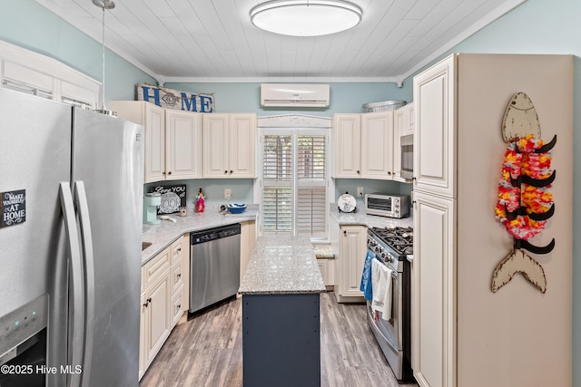209 W St George St, Southport, NC 28461 - kitchen featuring appliances with stainless steel finishes, a wall mounted AC, light stone counters, ornamental molding, and light wood finished floors