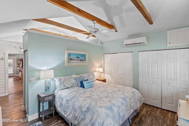 209 W St George St, Southport, NC 28461 - bedroom with a wall unit AC, two closets, dark wood-type flooring, baseboards, and ceiling fan