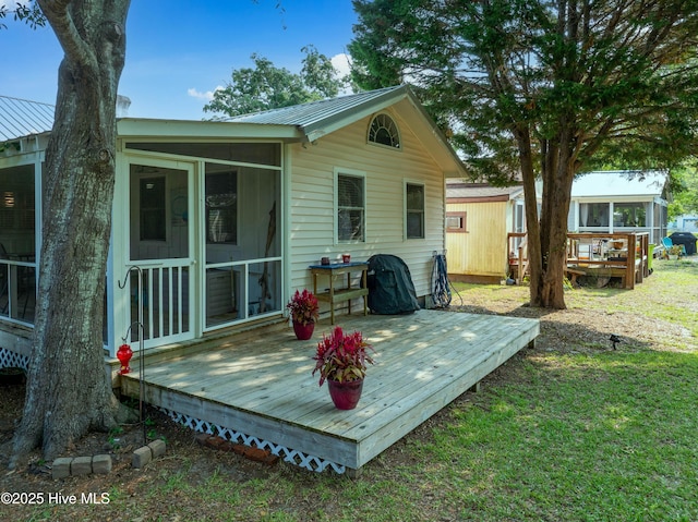 209 W St George St, Southport, NC 28461 - wooden terrace featuring a sunroom