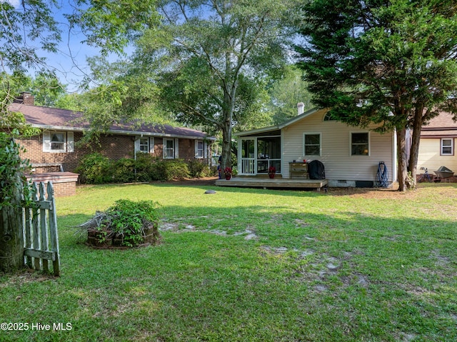 209 W St George St, Southport, NC 28461 - view of grassy yard featuring a sunroom and a deck