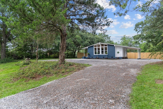 5302 Autumn Dr, Wilmington, NC 28409 - mid-century modern home with gravel driveway and an attached carport