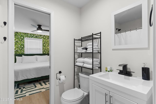 5302 Autumn Dr, Wilmington, NC 28409 - full bath featuring vanity, toilet, wood finished floors, and ceiling fan