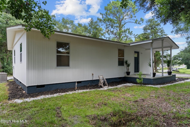 5302 Autumn Dr, Wilmington, NC 28409 - view of front of house with crawl space, a front yard, and central AC unit