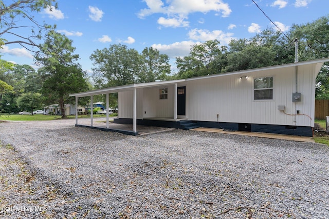5302 Autumn Dr, Wilmington, NC 28409 - manufactured / mobile home featuring crawl space, driveway, and a carport