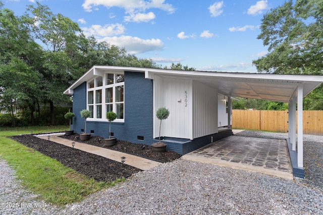 5302 Autumn Dr, Wilmington, NC 28409 - view of front of property with crawl space, driveway, and a carport