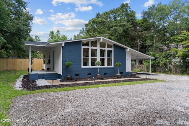5302 Autumn Dr, Wilmington, NC 28409 - mid-century modern home with crawl space, driveway, and an attached carport