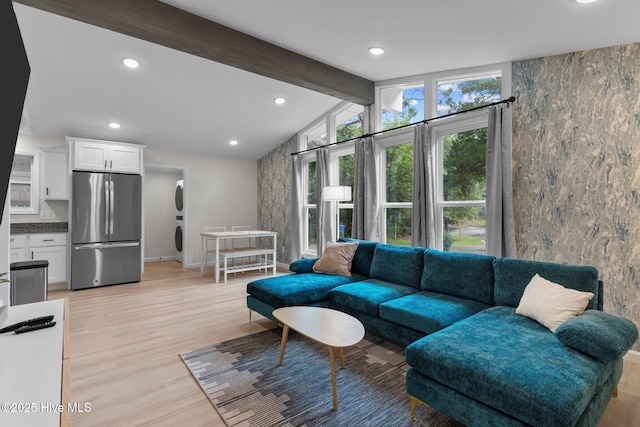 5302 Autumn Dr, Wilmington, NC 28409 - living room with light wood-style flooring, recessed lighting, baseboards, stacked washer / drying machine, and an accent wall