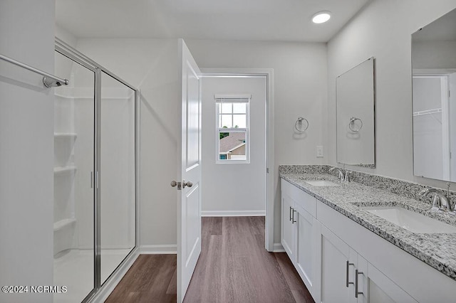 246 Kite Cir NE Lot 667, Bolivia, NC 28422 - full bath featuring wood finished floors, a shower stall, double vanity, and baseboards