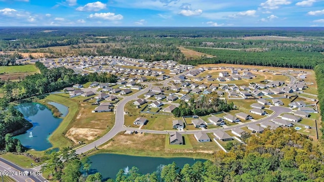 246 Kite Cir NE Lot 667, Bolivia, NC 28422 - aerial view of property's location featuring nearby suburban area, a large body of water, and a forest