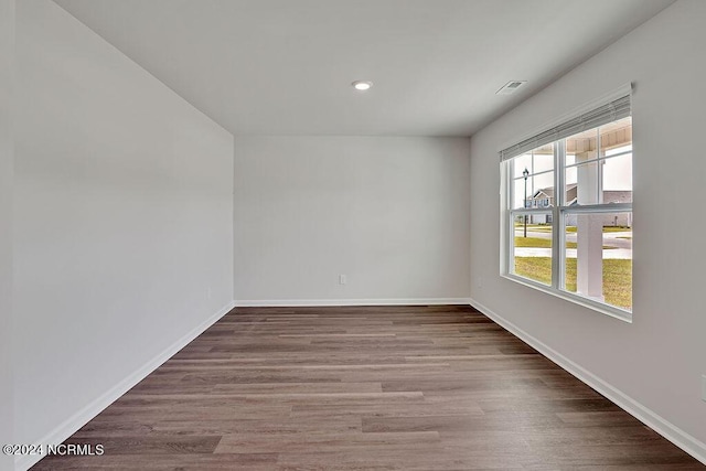 246 Kite Cir NE Lot 667, Bolivia, NC 28422 - spare room with wood finished floors, baseboards, and recessed lighting