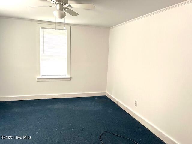 3356 Howard Ave, Tarboro, NC 27886 - spare room with a ceiling fan, dark colored carpet, ornamental molding, and baseboards