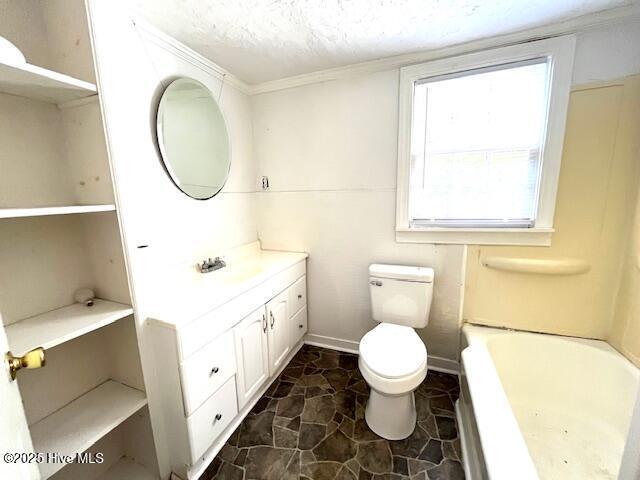 3356 Howard Ave, Tarboro, NC 27886 - full bath with vanity, a bath, a textured ceiling, toilet, and stone finish floors