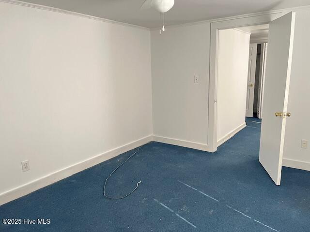 3356 Howard Ave, Tarboro, NC 27886 - spare room featuring baseboards, ceiling fan, and dark carpet