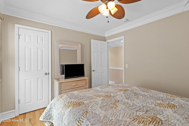 612 N Carolina Beach Ave Unit 3A, Carolina Beach, NC 28428 - bedroom featuring crown molding, light wood-type flooring, and a ceiling fan