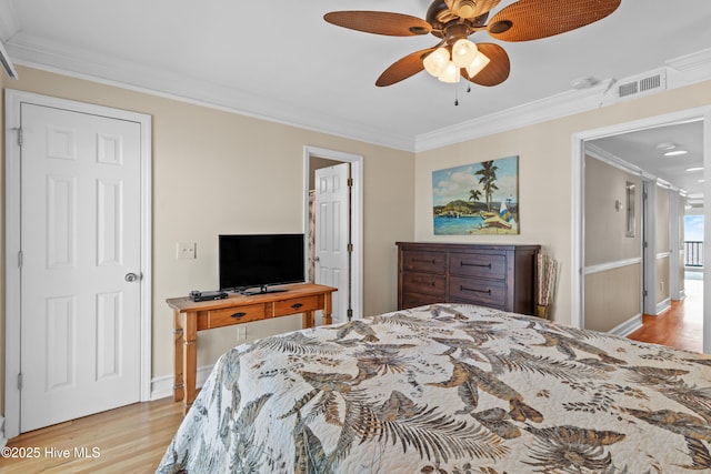 612 N Carolina Beach Ave Unit 3A, Carolina Beach, NC 28428 - bedroom featuring wood finished floors, ornamental molding, baseboards, and ceiling fan