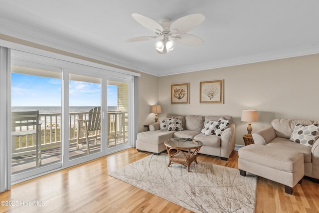 612 N Carolina Beach Ave Unit 3A, Carolina Beach, NC 28428 - living room with ornamental molding, a water view, a ceiling fan, and wood finished floors