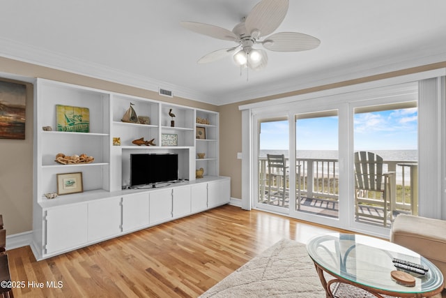 612 N Carolina Beach Ave Unit 3A, Carolina Beach, NC 28428 - living room with light wood finished floors, ceiling fan, crown molding, and baseboards